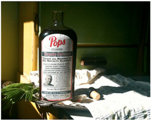 pops manual cover bottle on side table